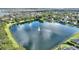Aerial view of lake with fountain in community at 357 Magneta Loop, Auburndale, FL 33823