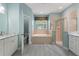 Bathroom features a soaking tub, shower, and dual sinks at 357 Magneta Loop, Auburndale, FL 33823