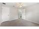Bedroom with ceiling fan and access to bathroom at 357 Magneta Loop, Auburndale, FL 33823