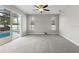 Bright Gathering room with pool view and sliding glass doors at 357 Magneta Loop, Auburndale, FL 33823
