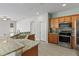Spacious kitchen with granite countertops and stainless steel appliances at 357 Magneta Loop, Auburndale, FL 33823