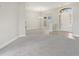 Bright living room with gray carpet and wood-look floors at 357 Magneta Loop, Auburndale, FL 33823
