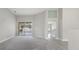 Open living area with access to kitchen and pool at 357 Magneta Loop, Auburndale, FL 33823