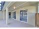 Covered patio with pool access and sliding glass doors at 357 Magneta Loop, Auburndale, FL 33823
