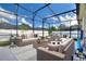 Relaxing covered patio with outdoor seating at 357 Magneta Loop, Auburndale, FL 33823