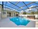 Screened pool and spa with covered patio at 357 Magneta Loop, Auburndale, FL 33823