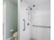 Walk-in shower with grab bars and tiled walls at 357 Magneta Loop, Auburndale, FL 33823