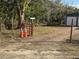 Gravel driveway with gated entrance to Hancock Pond at 37 Hall St, Lake Wales, FL 33898