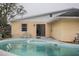 Inviting kidney-shaped pool with patio at 6102 N Fork Ct, Lakeland, FL 33809