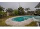 Relaxing kidney-shaped pool surrounded by a fenced yard at 6102 N Fork Ct, Lakeland, FL 33809