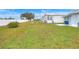 Large grassy backyard with a privacy fence at 6308 Bayberry Ne Blvd, Winter Haven, FL 33881