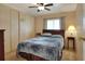 Bright bedroom with double bed and ceiling fan at 6308 Bayberry Ne Blvd, Winter Haven, FL 33881