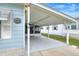 Covered carport next to the mobile home at 6308 Bayberry Ne Blvd, Winter Haven, FL 33881