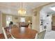 Bright dining area with table and chairs, offering a view of the living room at 6308 Bayberry Ne Blvd, Winter Haven, FL 33881