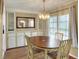 Charming dining area with wood table and chairs at 6308 Bayberry Ne Blvd, Winter Haven, FL 33881
