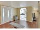 Inviting entryway with wood flooring and view into living area at 6308 Bayberry Ne Blvd, Winter Haven, FL 33881