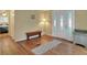 Bright entryway with bench and view to bedroom at 6308 Bayberry Ne Blvd, Winter Haven, FL 33881