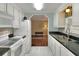 Well-equipped kitchen featuring white cabinetry and modern appliances at 6308 Bayberry Ne Blvd, Winter Haven, FL 33881