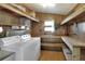 Laundry room with washer, dryer, and ample storage at 6308 Bayberry Ne Blvd, Winter Haven, FL 33881