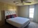 Bedroom with a queen-size bed and ceiling fan at 6447 Hollyberry Ne Ln, Winter Haven, FL 33881