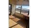 Sunroom with large windows, carpeted floor, and a writing desk at 6447 Hollyberry Ne Ln, Winter Haven, FL 33881