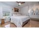 Main bedroom with large bed, wood floors, and ensuite bathroom at 81 Tyler Rd, Winter Haven, FL 33884