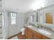 Bathroom with double vanity and shower at 1750 Fox Hill Dr, Lakeland, FL 33810