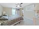 Spacious bedroom with a queen-size bed and ceiling fan at 1750 Fox Hill Dr, Lakeland, FL 33810