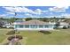 Community clubhouse with manicured landscaping at 1750 Fox Hill Dr, Lakeland, FL 33810