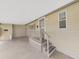 Covered patio with steps leading to the front entrance at 1750 Fox Hill Dr, Lakeland, FL 33810