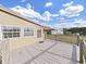 Deck view of the home's exterior and surrounding landscape at 1750 Fox Hill Dr, Lakeland, FL 33810