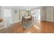 Dining room features hardwood floors and a table with four chairs at 1750 Fox Hill Dr, Lakeland, FL 33810