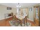 Cozy dining area with hardwood floors and a charming hutch at 1750 Fox Hill Dr, Lakeland, FL 33810
