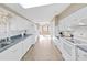 Bright kitchen with white cabinets, blue countertops, and tile floors at 1750 Fox Hill Dr, Lakeland, FL 33810