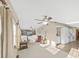 Bright living room with tile floors and ceiling fans at 1750 Fox Hill Dr, Lakeland, FL 33810