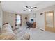Home office with sofa, desk and ceiling fan at 1750 Fox Hill Dr, Lakeland, FL 33810