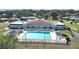Community pool with surrounding deck and lounge chairs at 1750 Fox Hill Dr, Lakeland, FL 33810