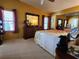 Spacious bedroom with large windows and plenty of closet space at 418 Village Sw Cir, Winter Haven, FL 33880