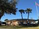 Community clubhouse with welcoming entrance at 418 Village Sw Cir, Winter Haven, FL 33880