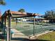 Community shuffleboard courts with covered seating at 418 Village Sw Cir, Winter Haven, FL 33880