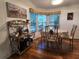Small dining area with round table and four chairs at 418 Village Sw Cir, Winter Haven, FL 33880
