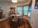 Small dining area with round table and four chairs at 418 Village Sw Cir, Winter Haven, FL 33880