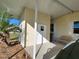 Private covered patio and exterior storage shed at 418 Village Sw Cir, Winter Haven, FL 33880