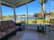 Relaxing screened porch overlooking lake and community amenities at 418 Village Sw Cir, Winter Haven, FL 33880