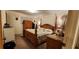 Main bedroom with a large wooden bed frame at 1190 S Goodman Rd, Champions Gate, FL 33896