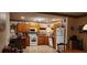 Galley kitchen with wood cabinets and a corner sink at 1190 S Goodman Rd, Champions Gate, FL 33896