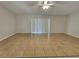 Spacious living room with tile flooring and sliding doors at 609 Estrada Ln, Kissimmee, FL 34758