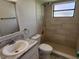 Clean bathroom, shower stall, toilet, and vanity at 609 Estrada Ln, Kissimmee, FL 34758