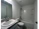 Clean bathroom with a bathtub, toilet, and vanity at 1049 Bergamot Dr, Bartow, FL 33830