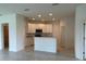 Modern kitchen with white cabinets, a breakfast bar, and stainless steel appliances at 1049 Bergamot Dr, Bartow, FL 33830